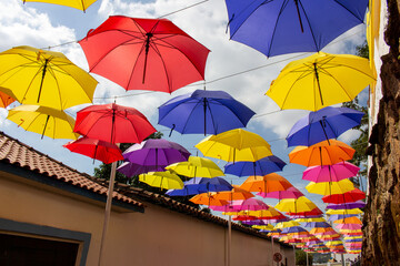 Fototapeta na wymiar Street covered with umbrellas. Street decoration