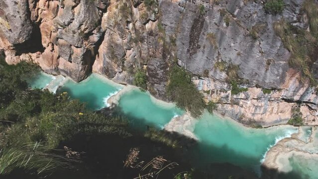 Natural pools of Millpu in Huancaraylla. Turquoise lagoons near Ayacucho, travel destination in Peru