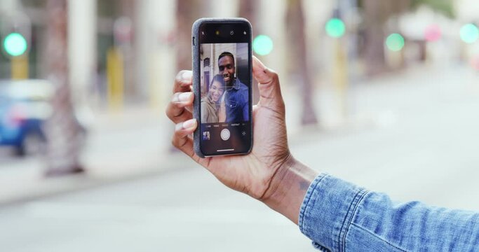 Hand, phone screen and selfie with couple outdoor, technology and social media post with mockup space. Mobile app, people smile in picture and urban with photography, bonding in city with smartphone