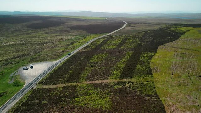The A543 on the legendary Evo Triangle, Denbigh Moors, Wales - one of the best driving roads in the world - Aerial drone flyover on a summer’s afternoon