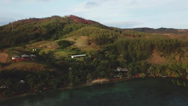 Fiji Drone Funky Fish Holiday vacation Malalo Island Nadi resort dry season Coral reef aqua deep blue scenic mountain landscape sunny beautiful relaxing surf paradise aerial cinematic forward movement