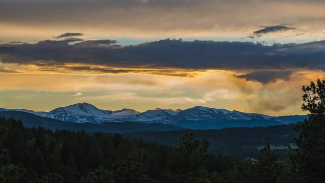 Timelapse sunset Denver Nuggets Broncos Rockies Mount Evans spring Rocky Mountain stunning landscape clouds orange yellow golds stunning beautiful Evergreen Conifer Pine Tree forest mountain layers