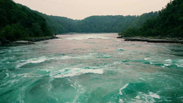 blue water river with strong and fast moving water in the forest, Niagara whirlpool
