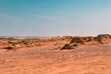 Sunny Serenity: Rocky Landscape and Mountains in the Desert on a Peaceful Afternoon