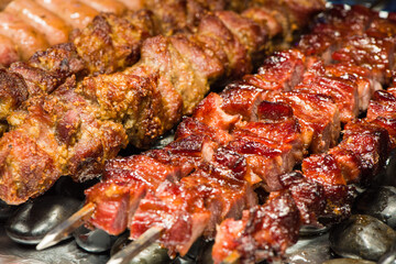 Grilled meat on hot stone. Food and cuisine concept.