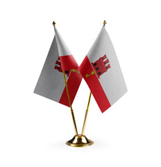 Small national flags of the Gibraltar on a white background