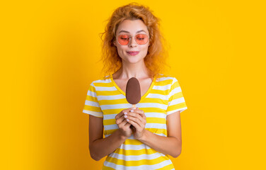 girl with icecream isolated on yellow. girl with icecream in studio. girl with icecream