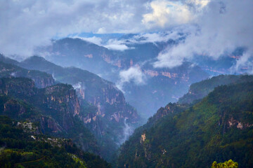 beautiful canyon with mist and amazing clouds, forest in summer, mexiquillo durango 