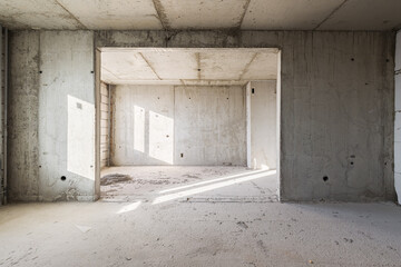 Fototapeta na wymiar Empty concrete commercial space without finishing with partitions