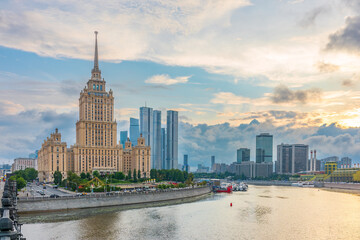 Obraz premium High-rise stalinist building near river at summer sunset in Moscow, Russia. Historic name is Hotel Ukraine.
