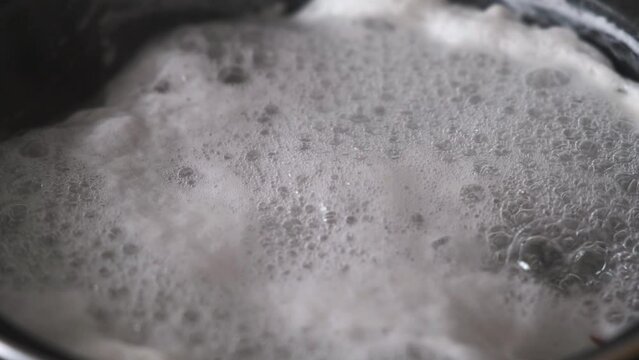 texture of bubbles and foam when heating or cooking in a saucepan
