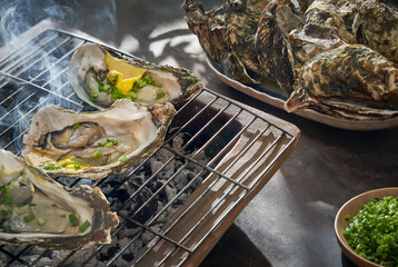 Vietnamese food homemade grilled, roasted fresh oyster seafood with cheese sauce, traditional life...