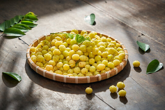 Vietnamese food fresh star gooseberry traditional life style decoration with wooden table and green leaf            
