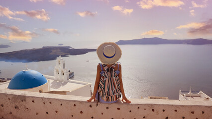 Happy a holiday in Summer with young woman in hat as a happy freedom lifestyle in Aegean sea mediterranean at Santorini,greece. © SASITHORN