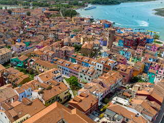Naklejka na ściany i meble Burano colored houses island. Rainbow city. Positive drone view. 