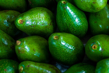 Fresh organic avocados, top view