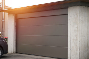 Obraz na płótnie Canvas Exterior view of a beautiful house with garage gate.
