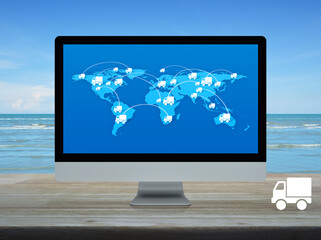Delivery truck icon with connection line and world map on computer screen on table over tropical sea and blue sky, Business transportation online concept, Elements of this image furnished by NASA