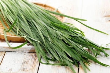 Close Up Kucai or Chives on Wooden Table
