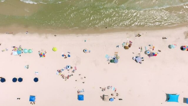 Gulf Shores, Alabama beach with drone video moving overhead.