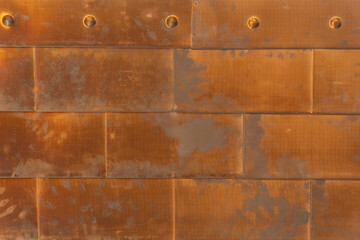 Texture of rusty processed metal plates with rivets