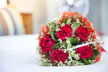 wedding bouquet of roses honey moon bed