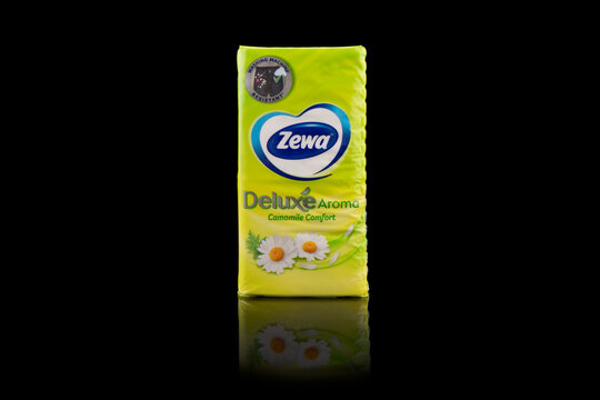 Yerevan, Armenia, June8, 2023: Packs of Zewa Deluxe napkins on black.