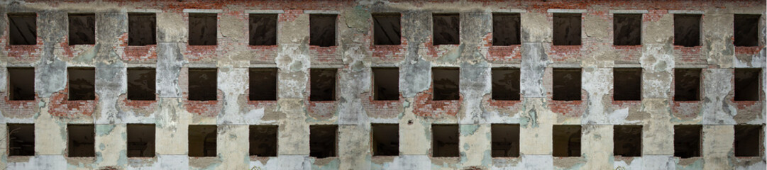 Apartment building without windows left in ruin, front view banner