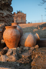 Large earthenware orange rustic terracotta pots at ancient historical site