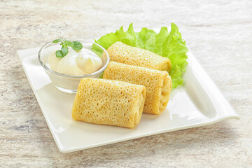 Stuffed pancakes with meat and cream