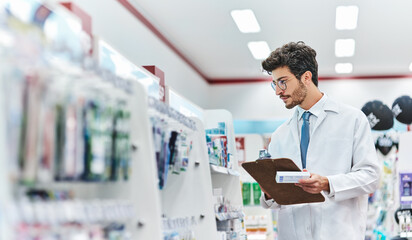 Pharmacist, medicine and man with a clipboard in pharmacy to check stock of products in retail...