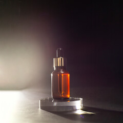 Brown bottle with dropper with a beauty serum on glass podium on black background. Glass packaging for cosmetic product, essential aroma oil. Skin care, hydration and nutrition with collagen.
