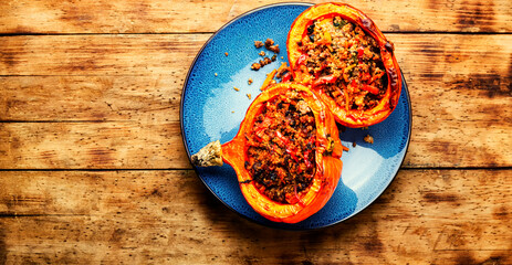 Roasted pumpkin with minced meat and quinoa,space for text - obrazy, fototapety, plakaty