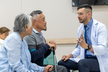 Obraz premium Mature couple listening recommendation from young doctor in hospital