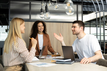 Young people working in office, coworking and office concept