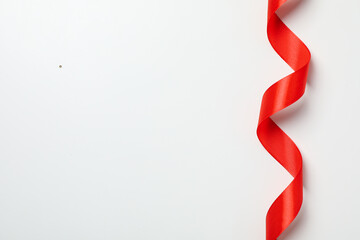 Concept of different ribbons, red ribbon on white background