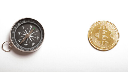 cryptocurrency, direction and money concept. bitcoin coins with a compass on a white background. place for text. E-commerce,