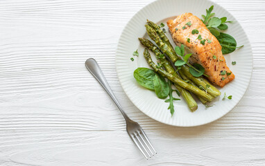 Baked Delicious salmon, green asparagus on  plate