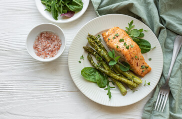 Baked Delicious salmon, green asparagus on  plate