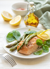 Baked Delicious salmon, green asparagus on  plate