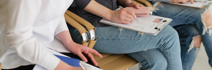 Expatriate people applying for american visa with dollar money and passports closeup. Moving to usa...