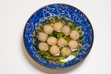 
Bakso Meatballs with Soup Served Chili Sauce Indonesia Food Style Popular Street Food Goodtasty decorate with carved Leek and Spring Onions topview