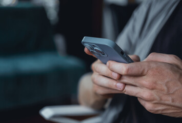 Young man using smartphone in hand, cafe, office,outdoor portrait business man, hipster style,...