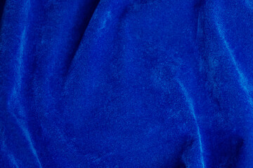 blue velvet fabric texture used as background. blue fabric background of soft and smooth textile material. There is space for text..