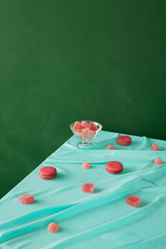 Marmalade and macarons on table