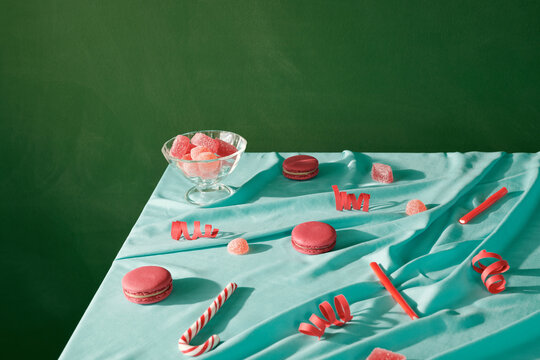 Pink treats on table with cloth