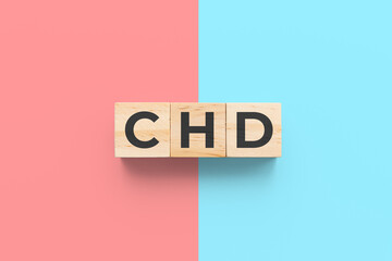 CHD (Congenital Heart Disease) wooden cubes on red and blue background