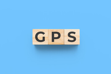 GPS (Global Positioning System) wooden cubes on blue background
