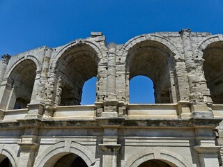 Fototapeta na wymiar Arles, May 2023 : Visit the beautiful city of Arles en Provence - Historical city with its arena and ancient theater - View on the arena 