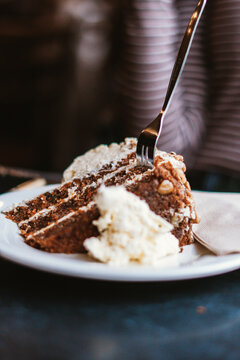 Portrait shot of carrot cake with two forks in Salamanca Markets, Tasmania, Australia